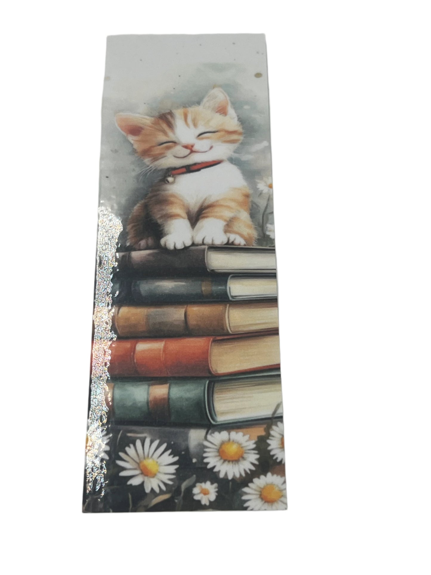Orange and white smiling cat on books