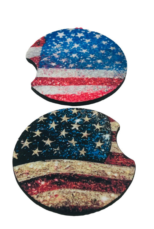 Two car coasters with American flag design on a white card.