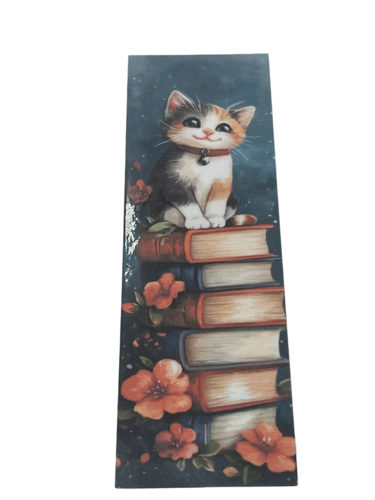 Calico Cat on pile of books